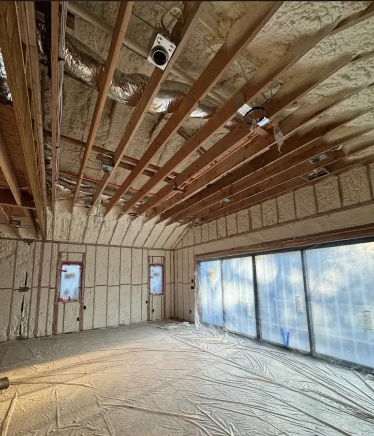 Interior walls and ceiling insulated with spray foam during new construction in Gilroy